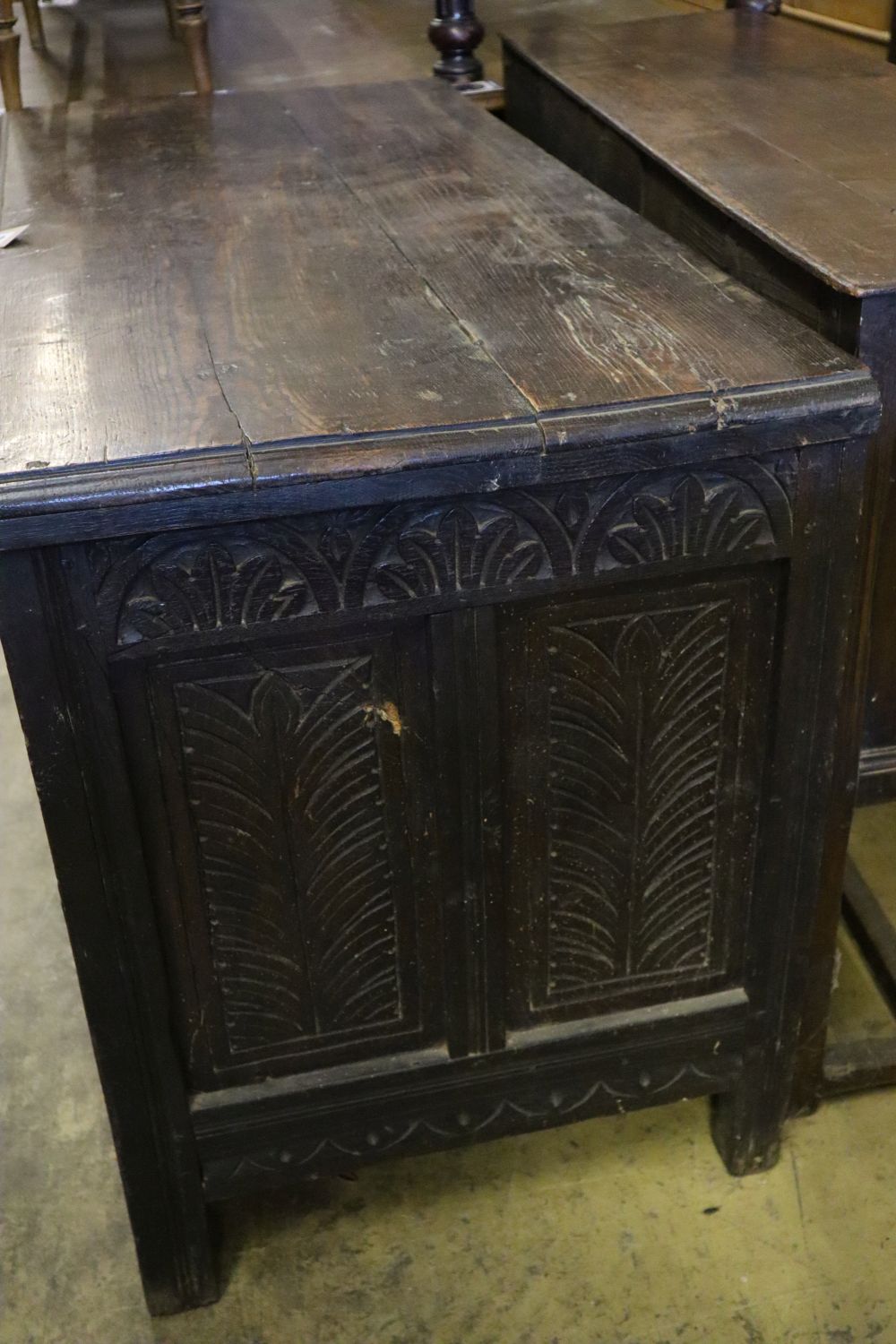 An early 18th century oak coffer, width 125cm depth 57cm height 76cm